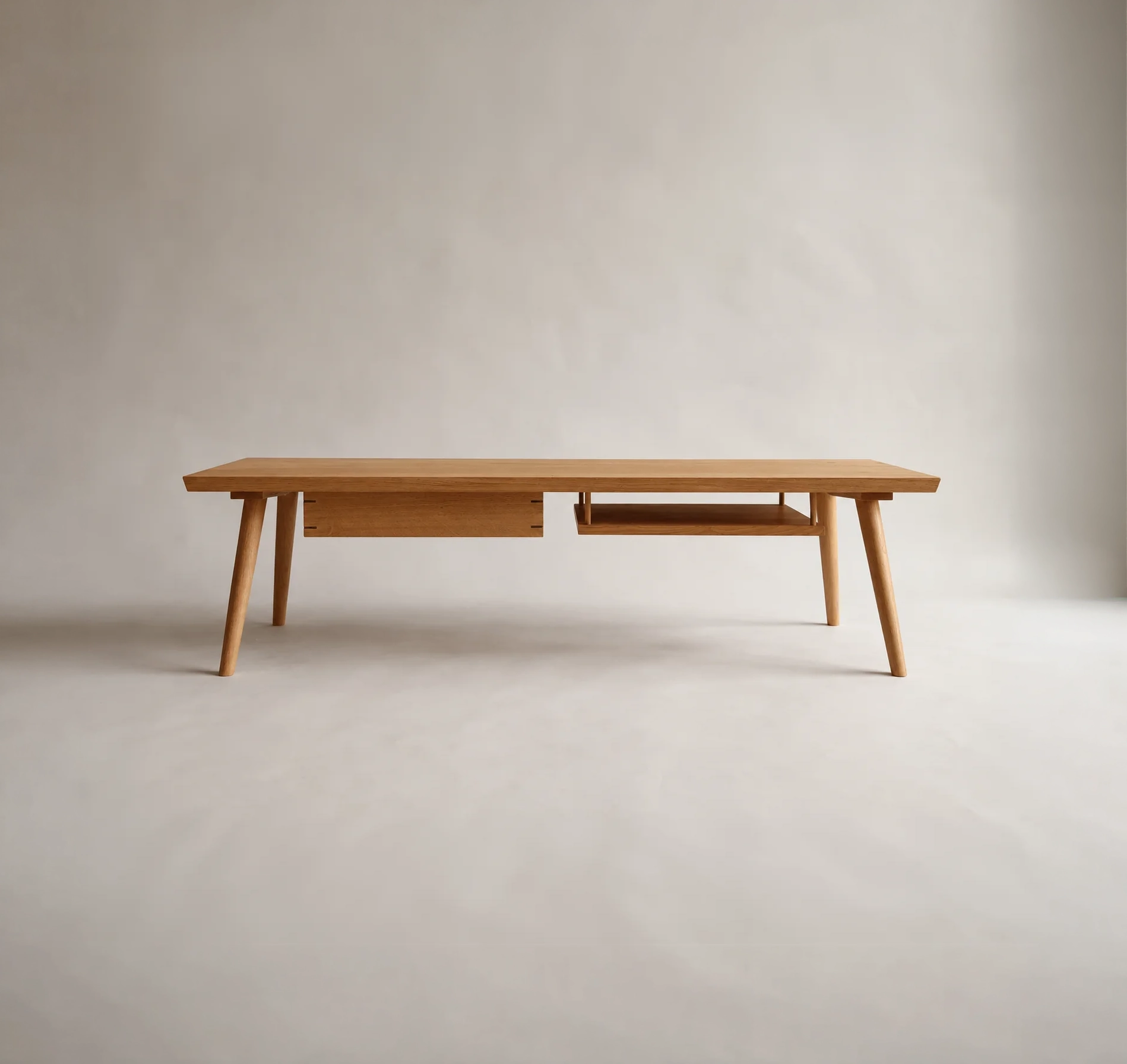 Front view of the Shibui Coffee Table with drawer and open shelf