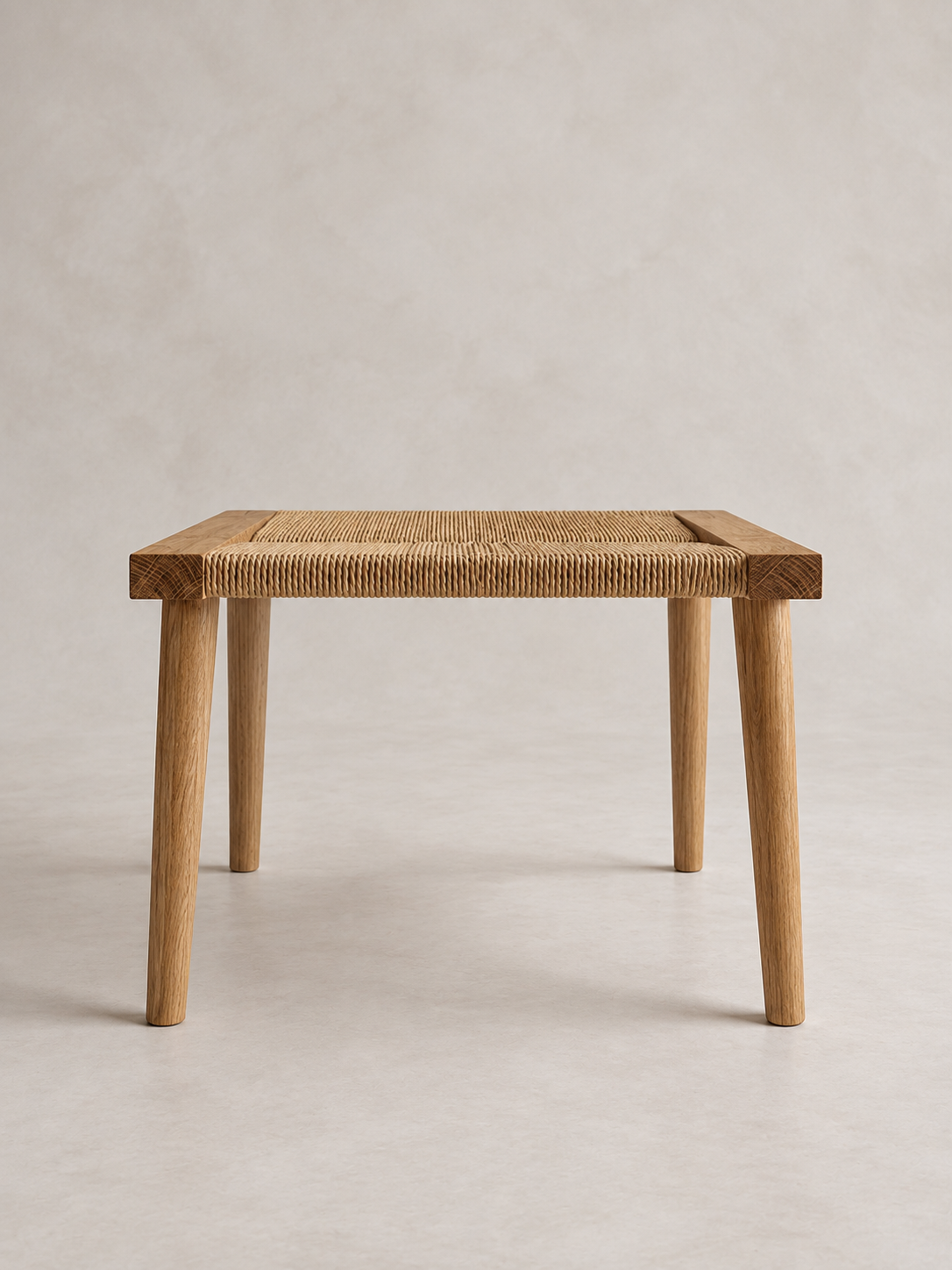 Front view of the Shibui Footstool with woven Danish cord seat