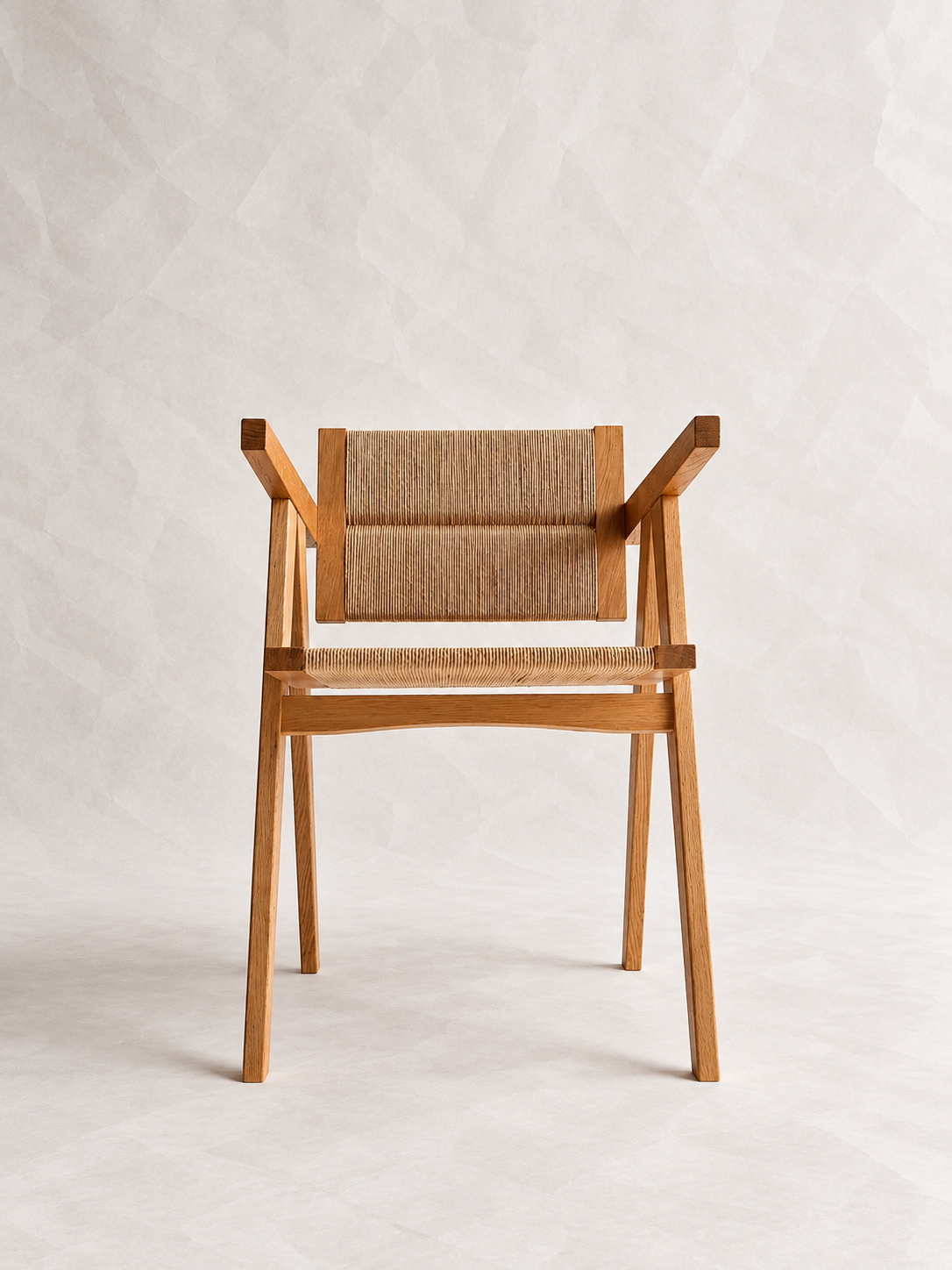 Front view of the Yoisho Chair with woven seat and backrest