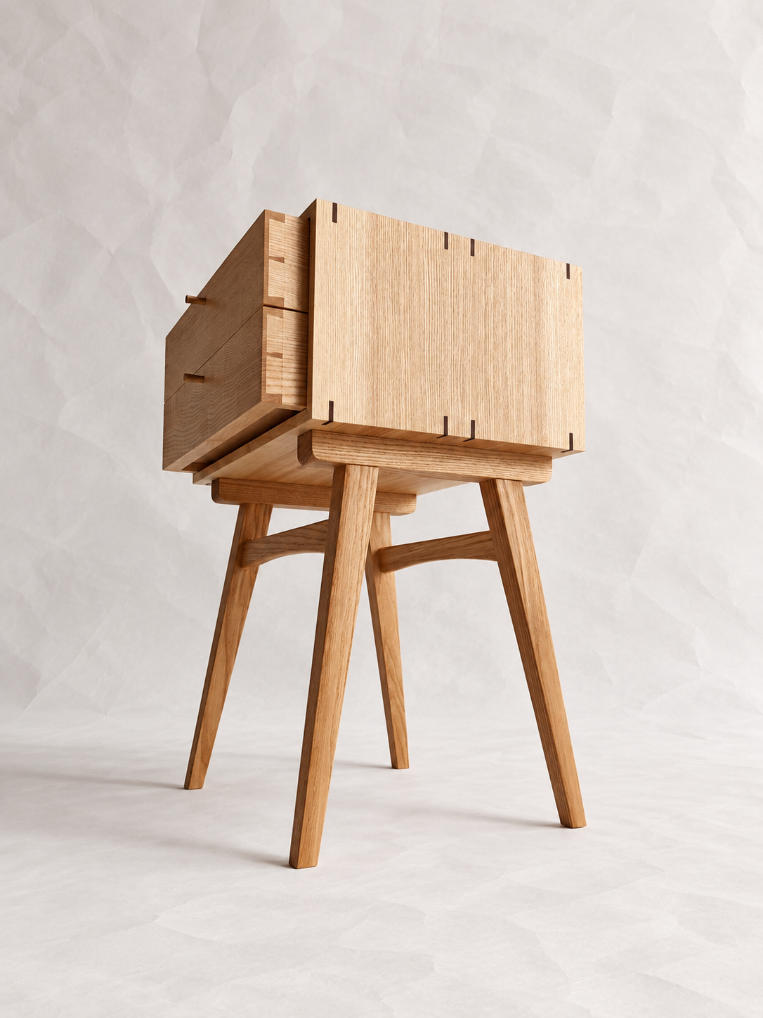 Low-angle view of the Chowa Side Stand with open drawers and angled legs