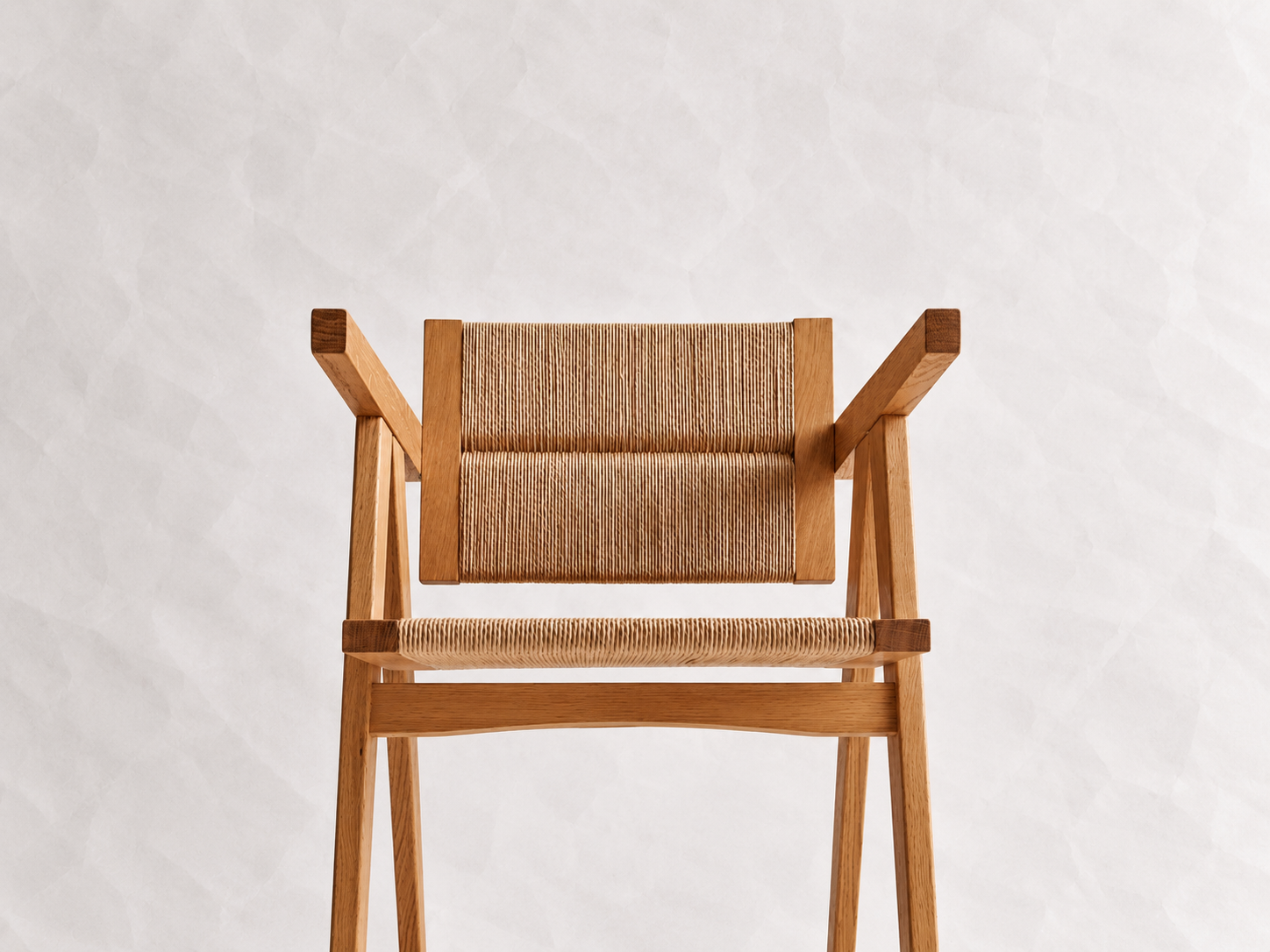 Rear view of the Yoisho Chair with woven Danish cord backrest