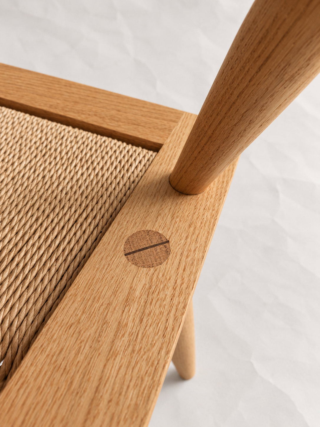 Shibui Chair woven seat corner and exposed circular timber joint