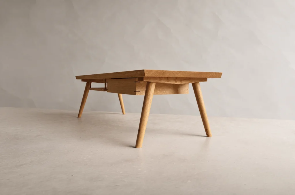 Shibui Coffee Table with shallow drawer and splayed timber legs