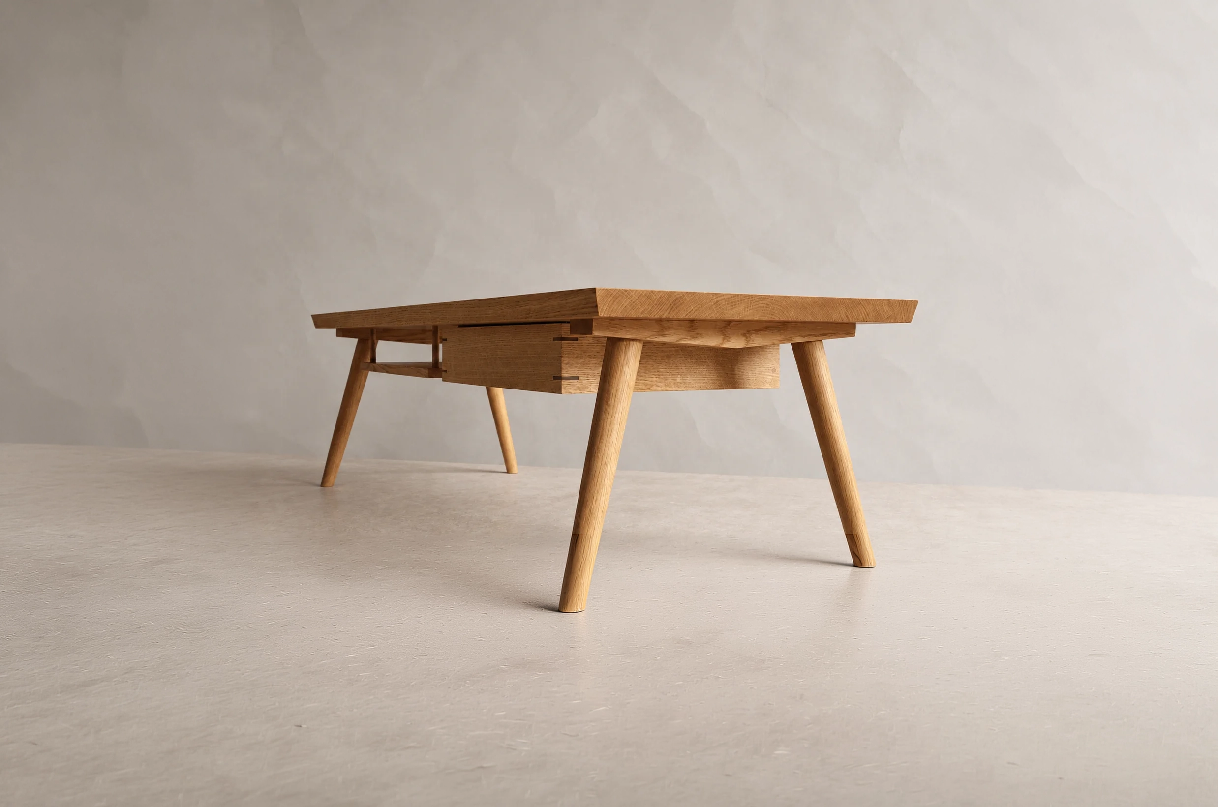 Shibui Coffee Table with shallow drawer and splayed timber legs