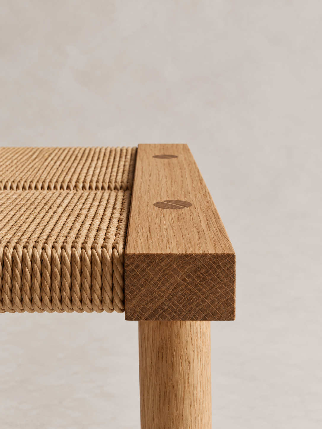 Shibui Footstool corner showing woven cord, timber rail and leg