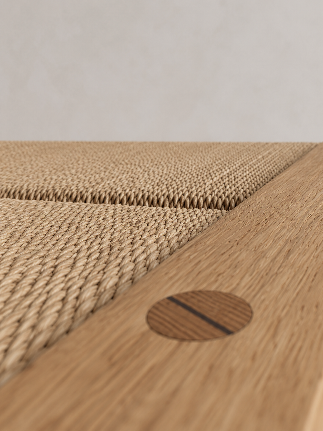 Shibui Footstool woven seat and circular wedged timber joint
