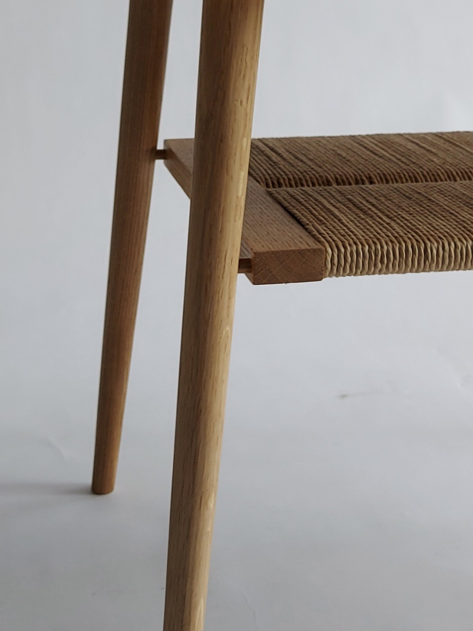 Shibui Side Stand tapered legs and woven shelf corner