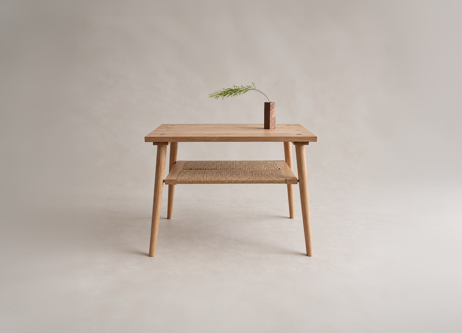 Shibui Side Stand with woven lower shelf and a small vase