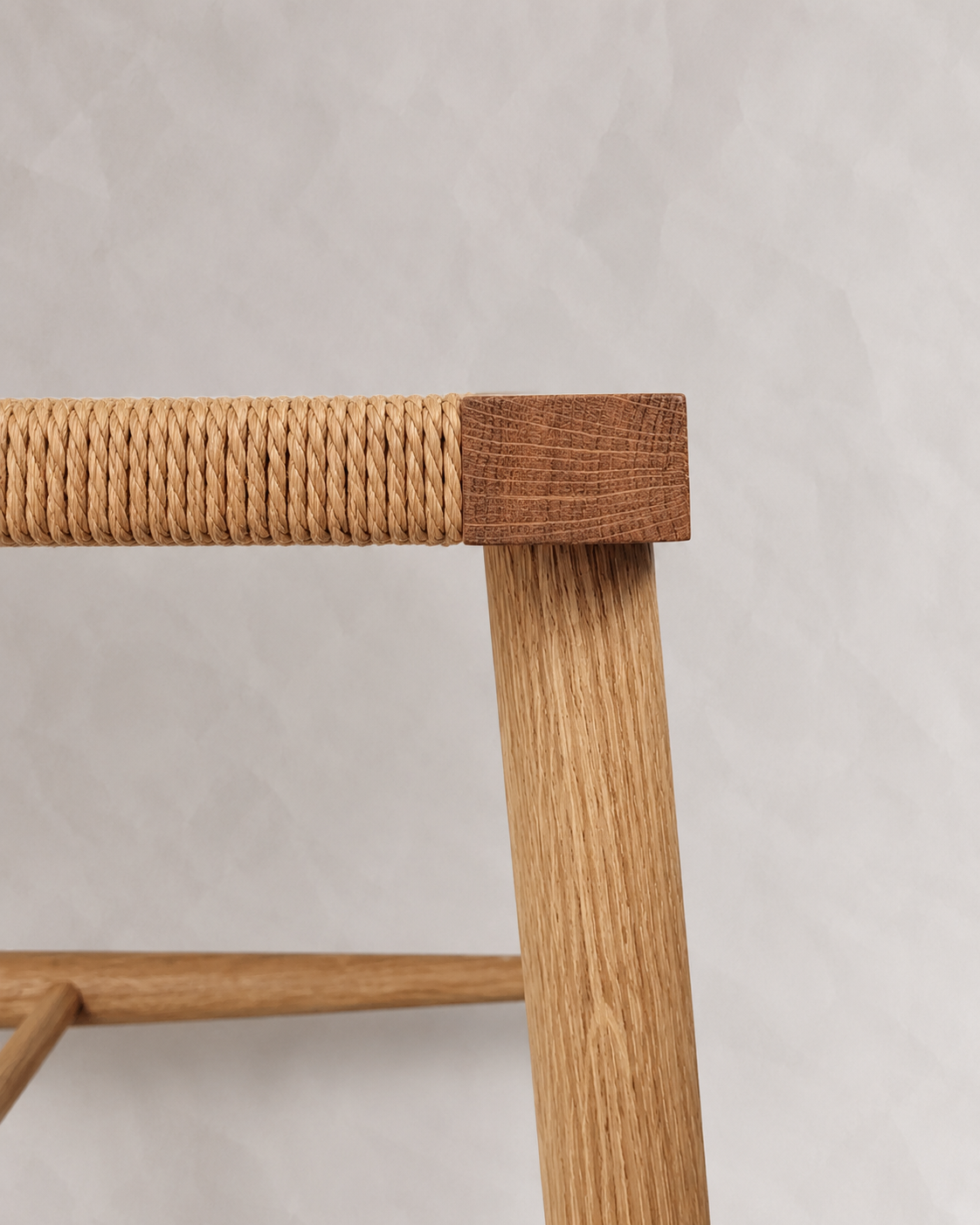 Shibui Stool leg beneath the woven Danish cord seat