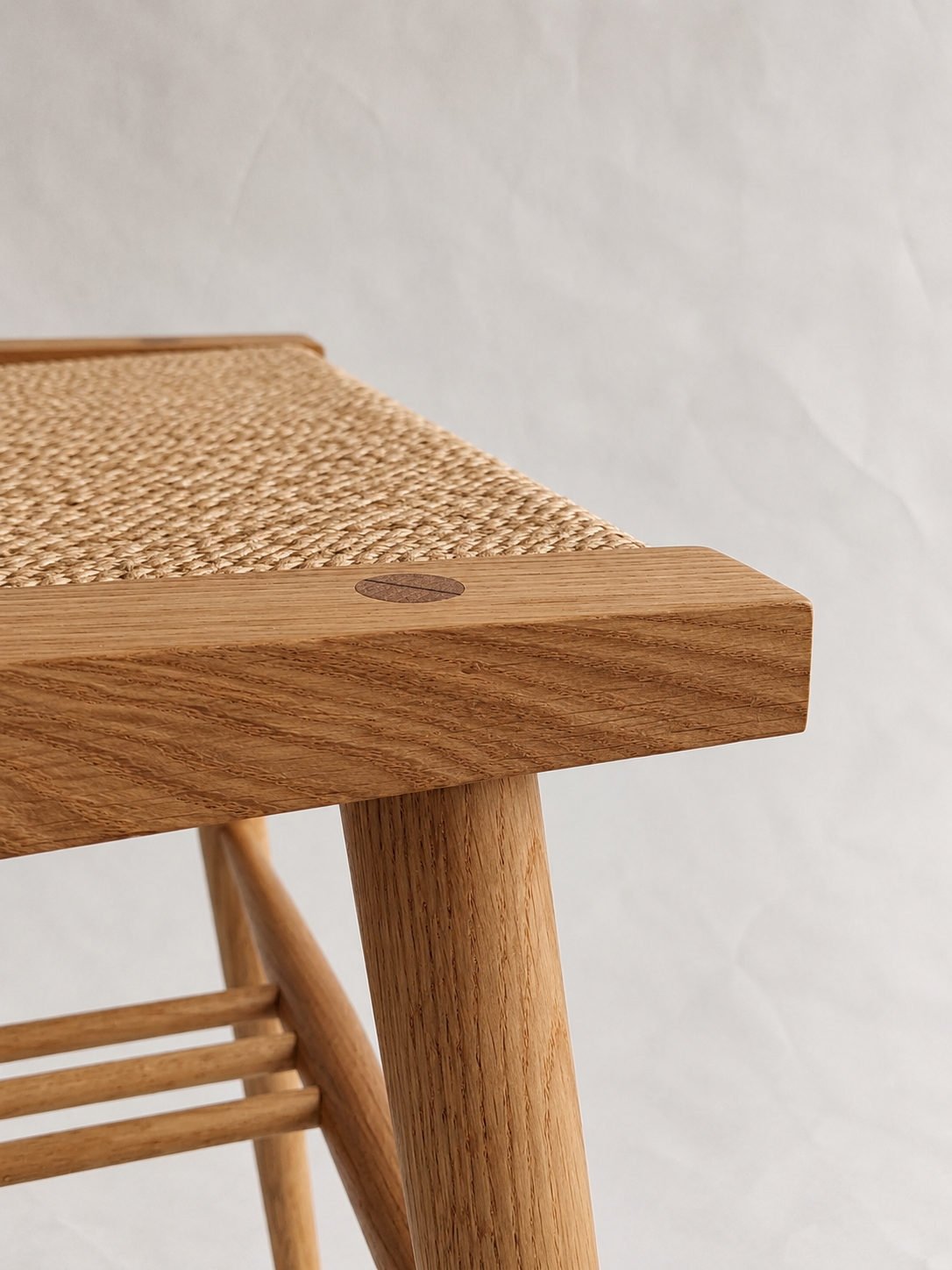 Shibui Stool woven seat corner and circular timber joint
