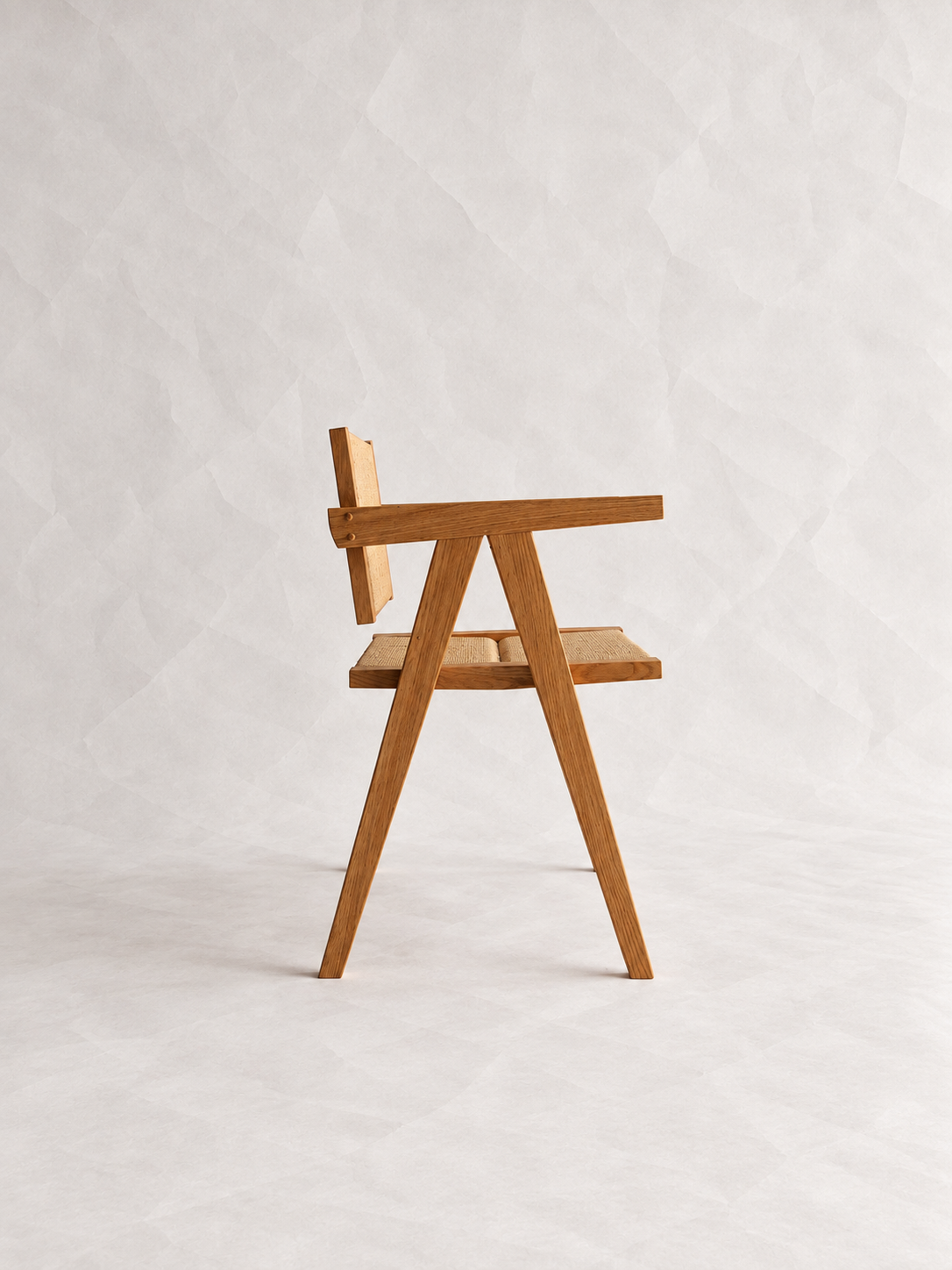 Side view of the Yoisho Chair with angled timber legs