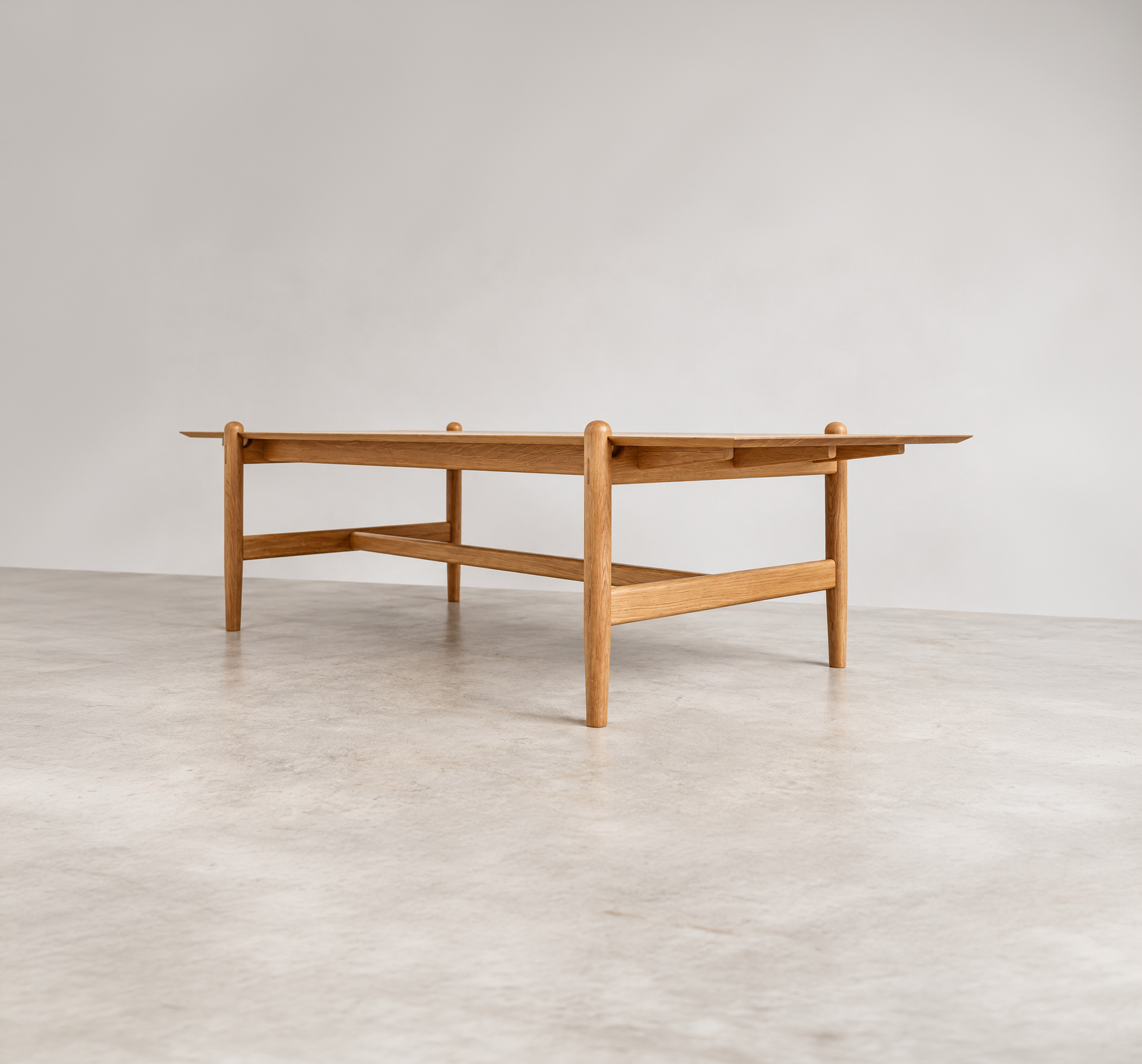 Three-quarter view of the Shibui Table with exposed legs and stretchers