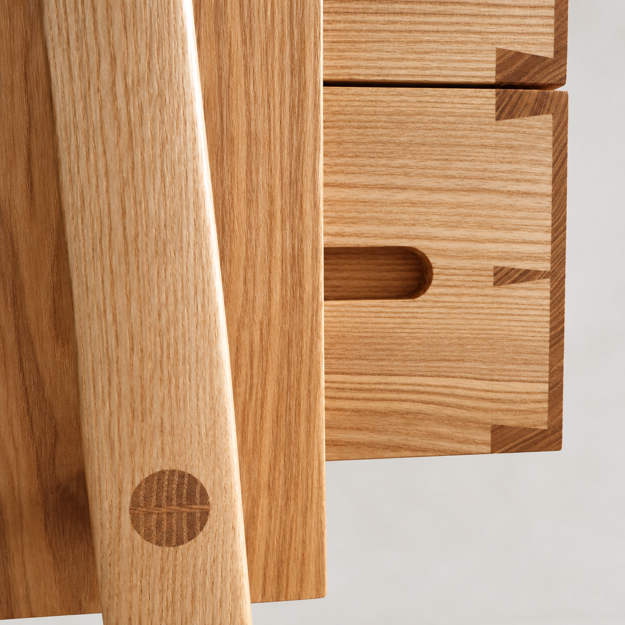 Yugen Side Stand drawer pull and circular leg joint detail