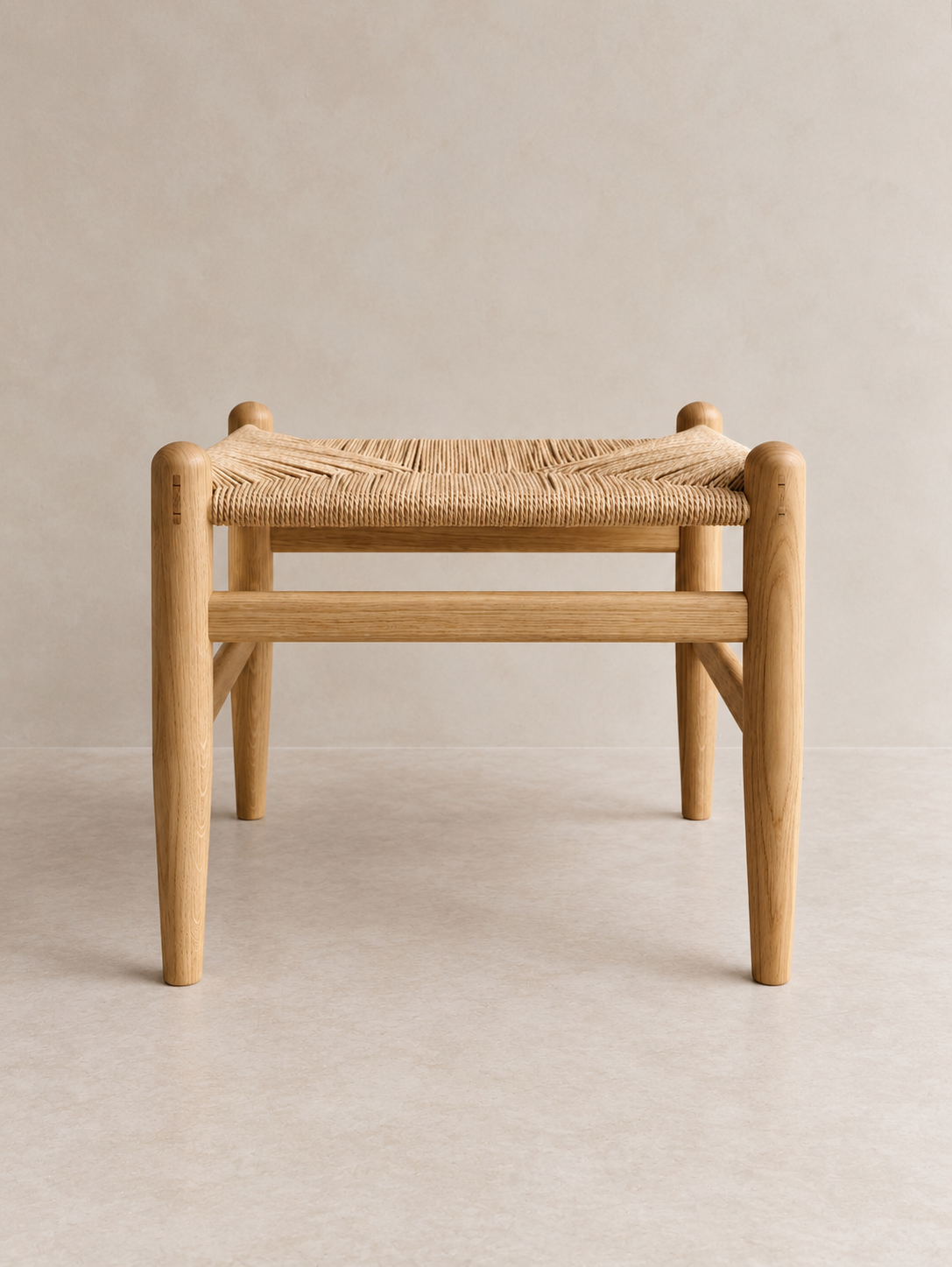 Front view of the Pett Stool with rounded timber legs